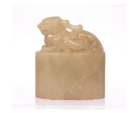 Soapstone seal of oviform Chinese, 19th Centurycarved with a recumbent Kilin and a cub facing right, the body of the seal eng