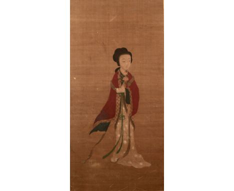 Mounted silk scroll Chinese, 18th/19th Century depicting a female figure holding a lotus in her left hand, unsigned, 78cm x 3