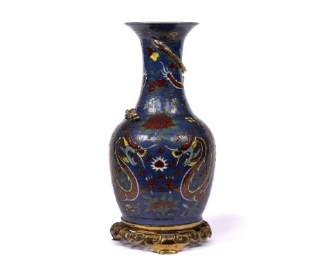 Ceramic vase Chinese decorated to the body depicting two dragons chasing a flaming pearl against a blue ground, with later me