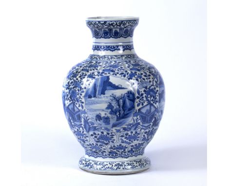 Blue and white baluster vaseChinese, Kangxi Period (1662-1722)decorated to the exterior with panels of flowering branches gro