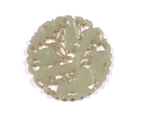 White jade pierced and carved medallion form pendant Chinese, 19th Century carved as a butterfly and two fish divided central