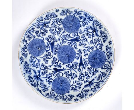 Large blue and white charger Chinese, Kangxi (1662-1722) painted with lotus flowers and trailing blossom, 39cm
