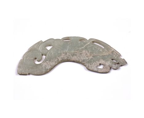 Archaic style jade carving  Chinese in the form of a dragon, with stylistic swirls across the body, 24cm across