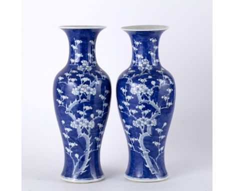 Pair of blue and white baluster vases Chinese, 19th Century each decorated with prunus blossoms and with Kangxi ring mark to 