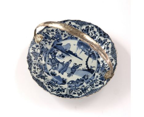 Blue and white dish Chinese, Kangxi Period (1662-1722) decorated to the centre with figures by a river, the outer border with