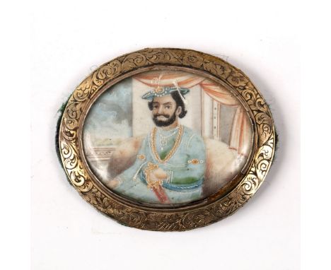 Indian School, 19th Century oval miniature portrait of a Maharaja, possibly Gulab Singh, watercolour on ivory in a metal moun