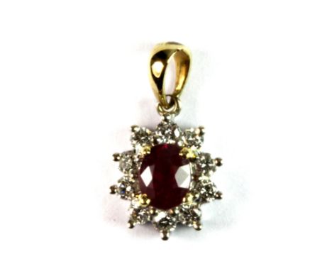 A yellow and white metal (tested 18ct gold) ruby and diamond cluster pendant.