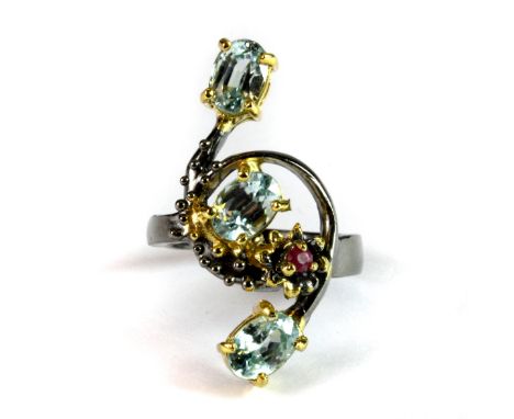 A Hana Maae designer 925 silver gilt ring set with blue topaz and a ruby, (M).