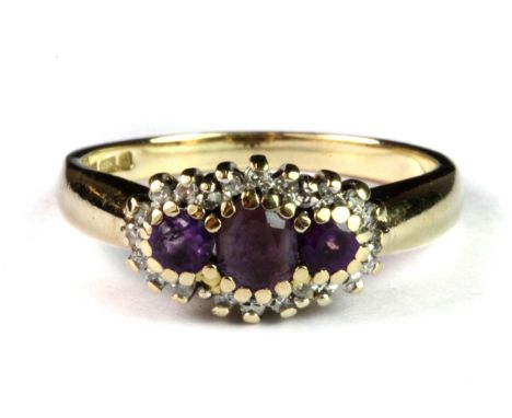 A 9ct yellow and white gold amethyst and diamond set ring (P.5).