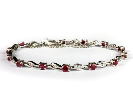 A 9ct white gold ruby and diamond bracelet.