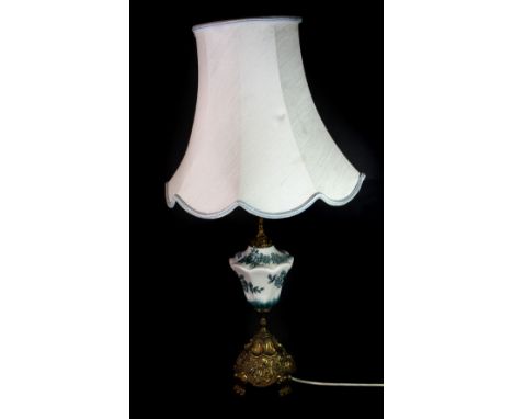 A porcelain and gilt brass lamp and shade, H. 73cm.
