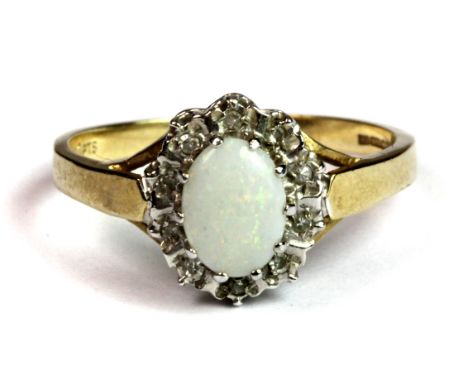 A 9ct yellow and white gold opal and diamond cluster ring (N.5).