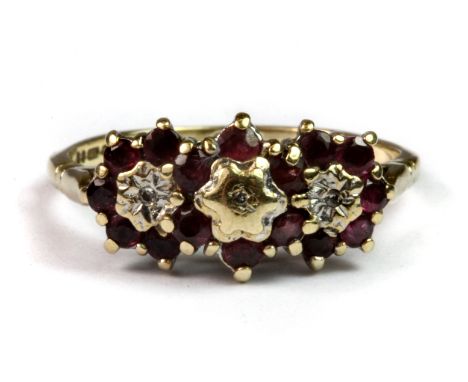 A 9ct yellow gold ruby and diamond triple cluster ring (R).