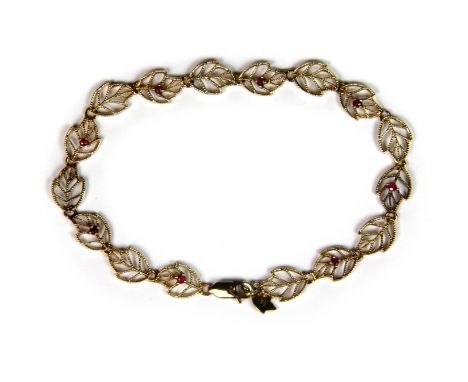 A lovely 9ct yellow gold ruby set leaf bracelet, L. 19cm.