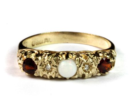 A 9ct yellow gold ring set with opal, diamonds and garnets (L).