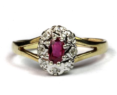 A 9ct yellow and white gold ruby and diamond cluster ring (M.5).