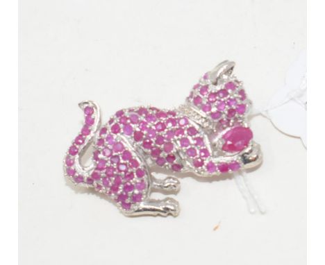 A silver and ruby cat brooch

Modern 