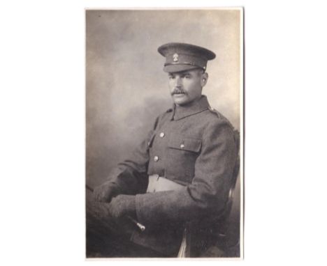 Grenadier Guards WWI Seated Officer portrait photo card in No.2 dress with gloves and swagger stick.