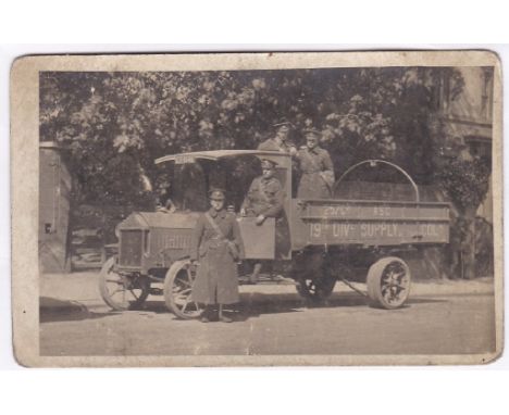 Army Service Corps WWI 257 Coy, 19th Div Supply Col Photo Card - four soldiers in greatcoats aboard a suppy truck (some wear 