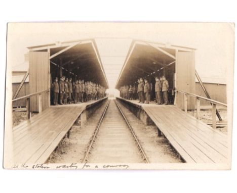 Royal Army medical Corps WWI-RP postcard, at the station waiting for a convoy-large number of troops on each platform as the 