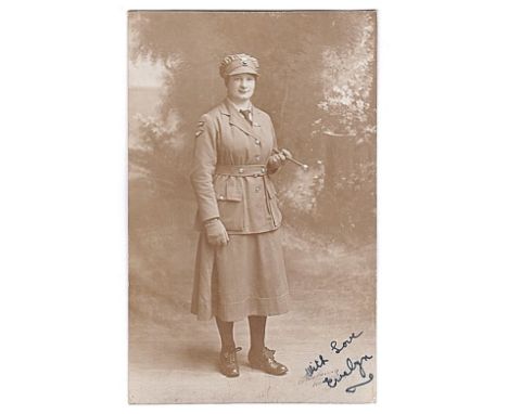 Womans Royal Air Force-a fine protrait photographic postcard of a pilot in uniform with swagger stick-signed with love Evelyn