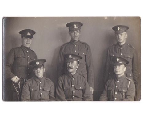 WWI soldiers(6) in a portrait photographic postcard name + Units listed over, Essex Regiment Royal Fusilers, Buffs + Monmouth