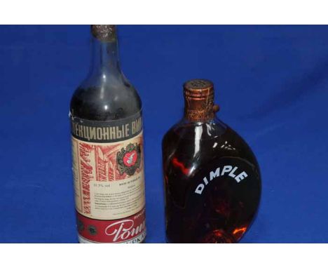 FIVE BOTTLES OF ALCOHOL
To include one bottle of Moldavian wine, Dimple Whisky 70° proof full bottle and half bottle, Big "T"