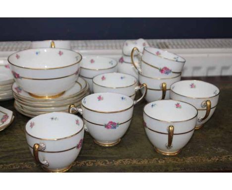 PARAGON FINE BONE CHINA TEA SERVICE 
pattern number 220255, decorated with floral motifs and with gilt banding on a cream gro