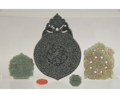 A COLLECTION OF THREE ISLAMIC MUGHAL JADE ORNAMENTS, 11cm x 7.5cm, 6cm x 5cm and 4.5cm x 4cm, together with a jade inset seal