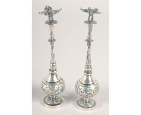 AN UNUSUAL PAIR OF 19TH CENTURY ISLAMIC MARKET CHINESE SILVER MINIATURE ROSEWATER SPRINKLERS, each with bird form finial, 12c