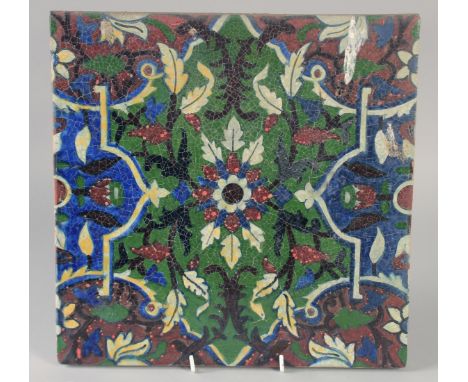 A FINE AND UNUSUAL LARGE 19TH CENTURY INDIAN TILE, with floral motif, 30.5cm square.