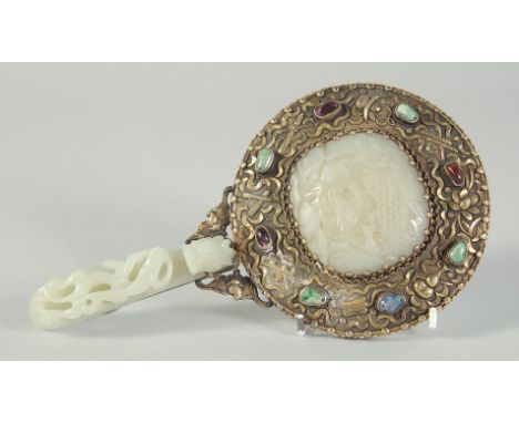 A CHINESE CARVED JADE AND GILT METAL HAND MIRROR, the handle made from a carved jade chilong belt hook, the mirror verso inse
