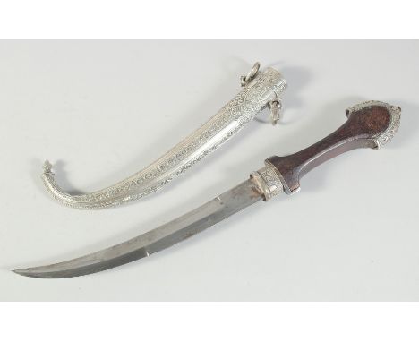 AN ISLAMIC MOROCCAN JAMBIYA DAGGER AND SCABBARD, 41cm long overall.