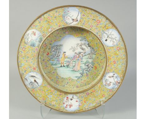 A FINE RARE QING DYNASTY YELLOW GROUND CLOISONNE ENAMEL CHARGER, decorated with a central panel depicting a scene of European