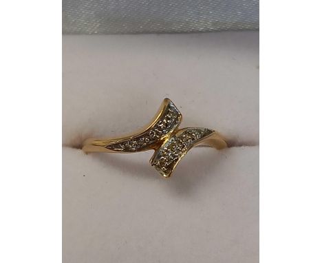 DIAMOND CROSS OVER RING SET IN 9ct, SIZE 'J'