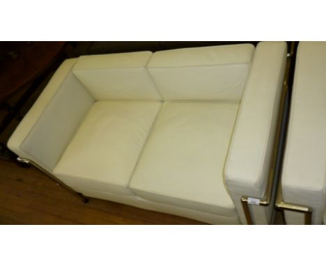 A modern Le Corbusier Petite Comfort two seater sofa, upholstered in a white leather material.