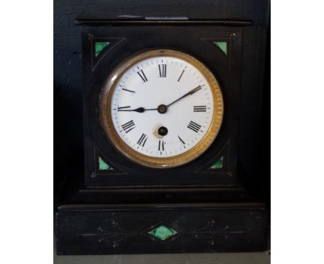 A Victorian slate and malachite inlaid mantel clock.