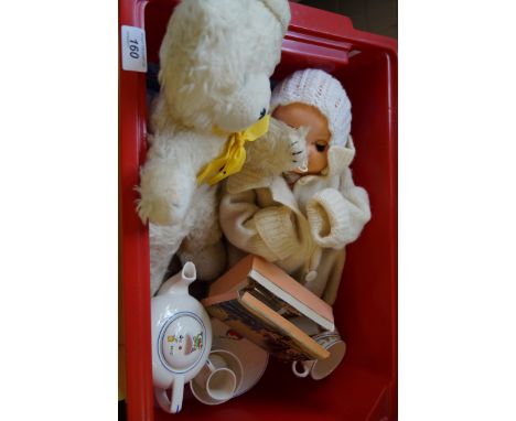 A mixed lot of assorted child related items to include a 1950s doll, part miniature children's tea service etc.