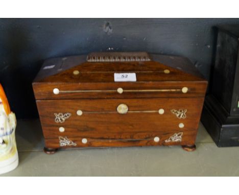 A Victorian mother of pearl inlaid mahogany tea caddy, raised on bun feet.