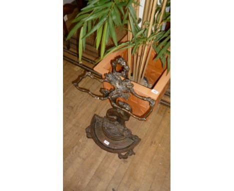 A good quality Victorian style stick stand decorated with a seated dog.