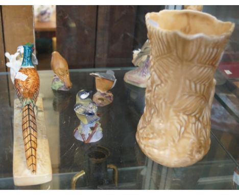 A mixed group of ceramic items to include a Sylvac relief moulded jug with a rabbit handle, together with a Beswick model of 