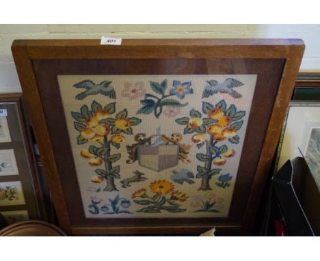 An oak framed firescreen/table with tapestry inset top.