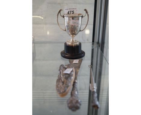 A mixed group of items to include a Birmingham hallmarked silver miniature trophy raised on ebonised plinth together with a s