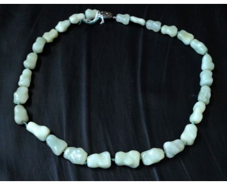 A jadeite jade bead necklace, the beads of irregular form (Please note the jadeite jade is untested)