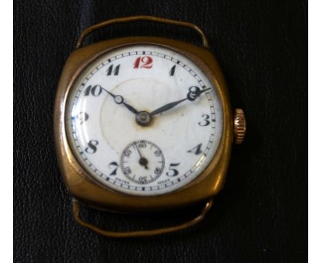 A WWI rolled gold wristwatchThe white enamel dial with Arabic numerals, with subsidiary seconds dial, impressed marks to inne