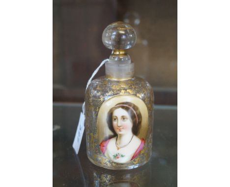 A 19th Century Bohemian perfume bottle and stopperThe clear glass body having gilt scrolls with a central hand-painted panel 