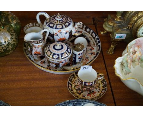 A 19th Century Continental tea service, decorated in the Imari palette with blue cross sword mark to base, together with a Ro