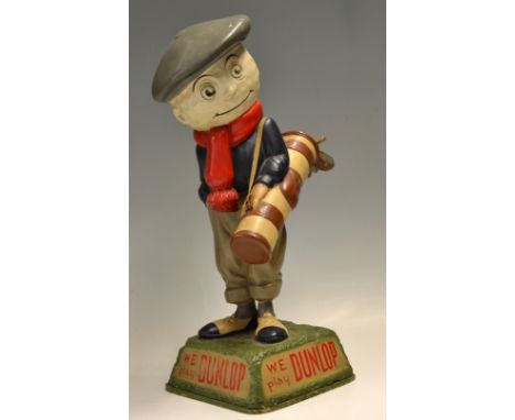 Dunlop Caddy  papier-mâché golf ball advertising figure-mounted on naturalistic splayed base inscribed to 2 panels "We play D