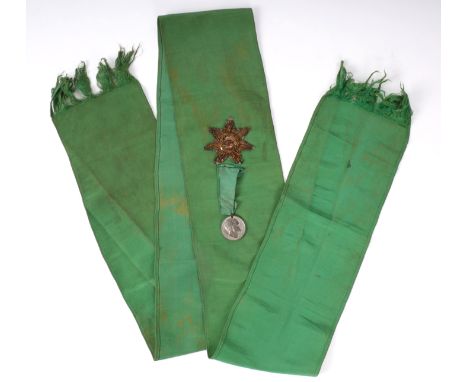 1875 Daniel O'Connell Centenary parade, marshal's sash. A green poplin sash with gilt bullion star and white metal O'Connell 