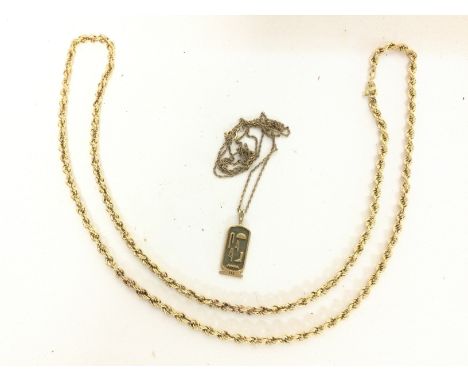 A 9ct gold Egyptian style pendant and a 9ct gold rope chain. Overall weight of 9g. Postage cat A